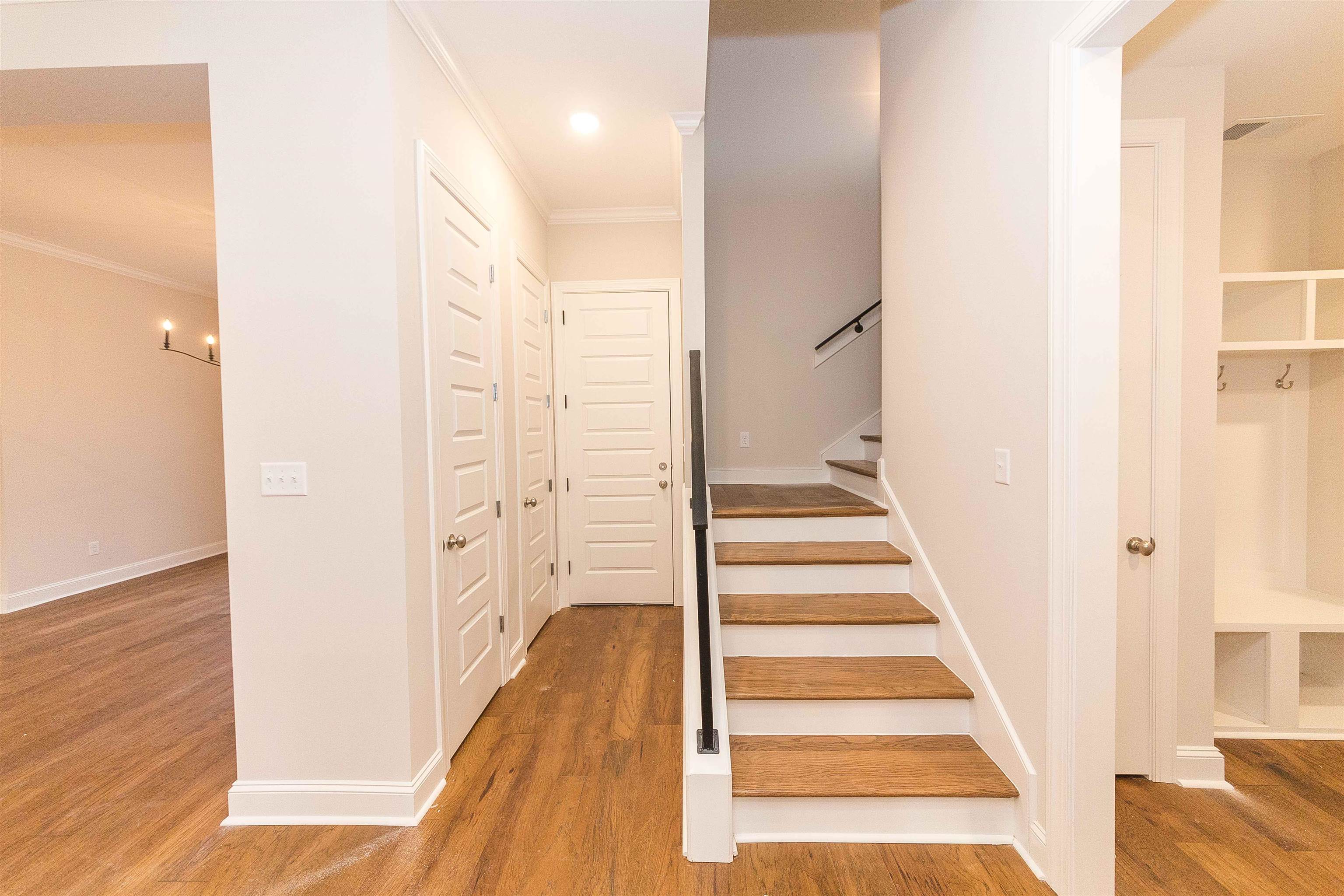 6441 Mccord Loop Arlington, TN 38002 - Photo 11 of 23 a view of a hallway with wooden floor and staircase