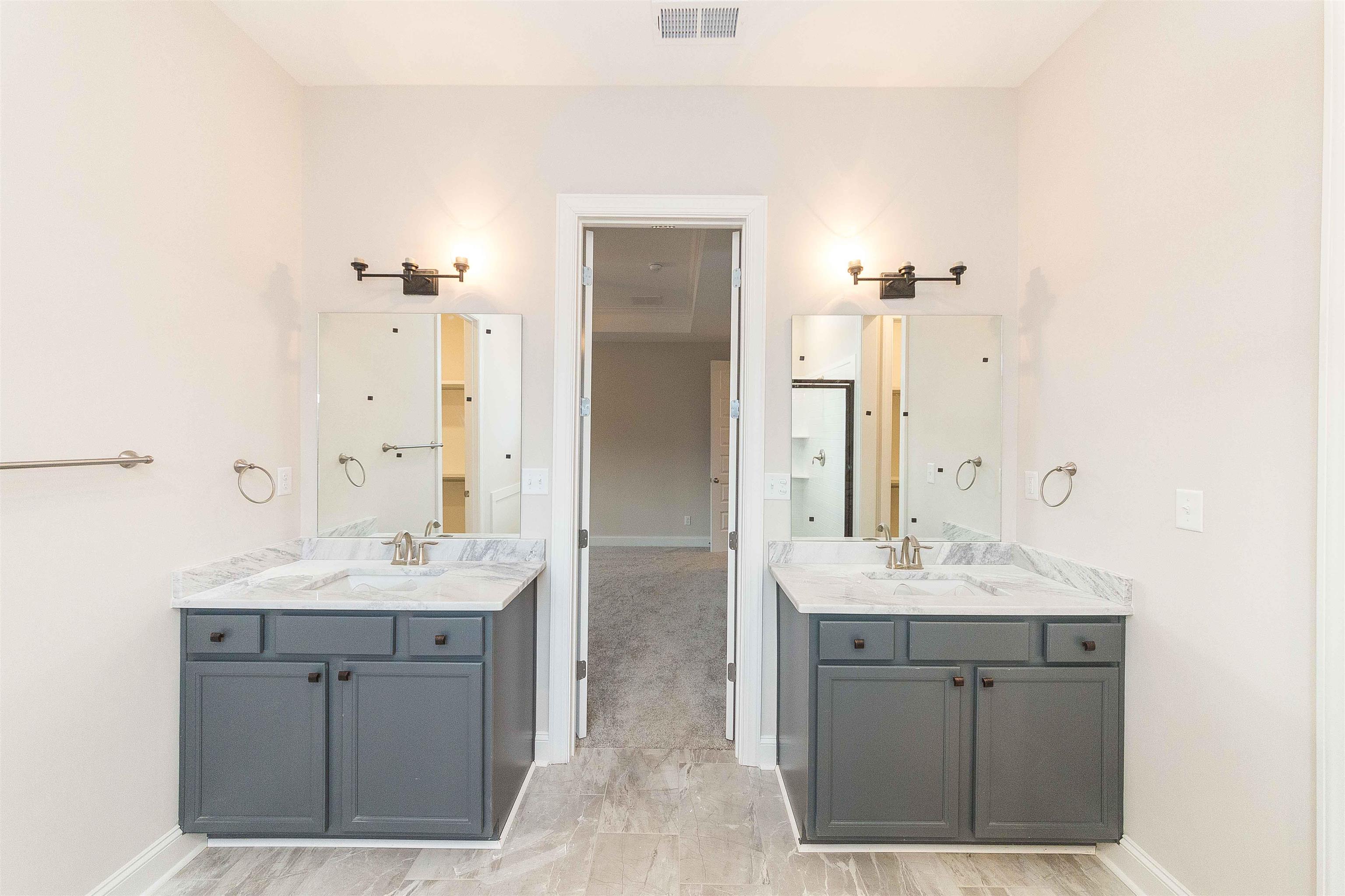 6441 Mccord Loop Arlington, TN 38002 - Photo 15 of 23 a bathroom with a sink double vanity granite tub shower and a mirror
