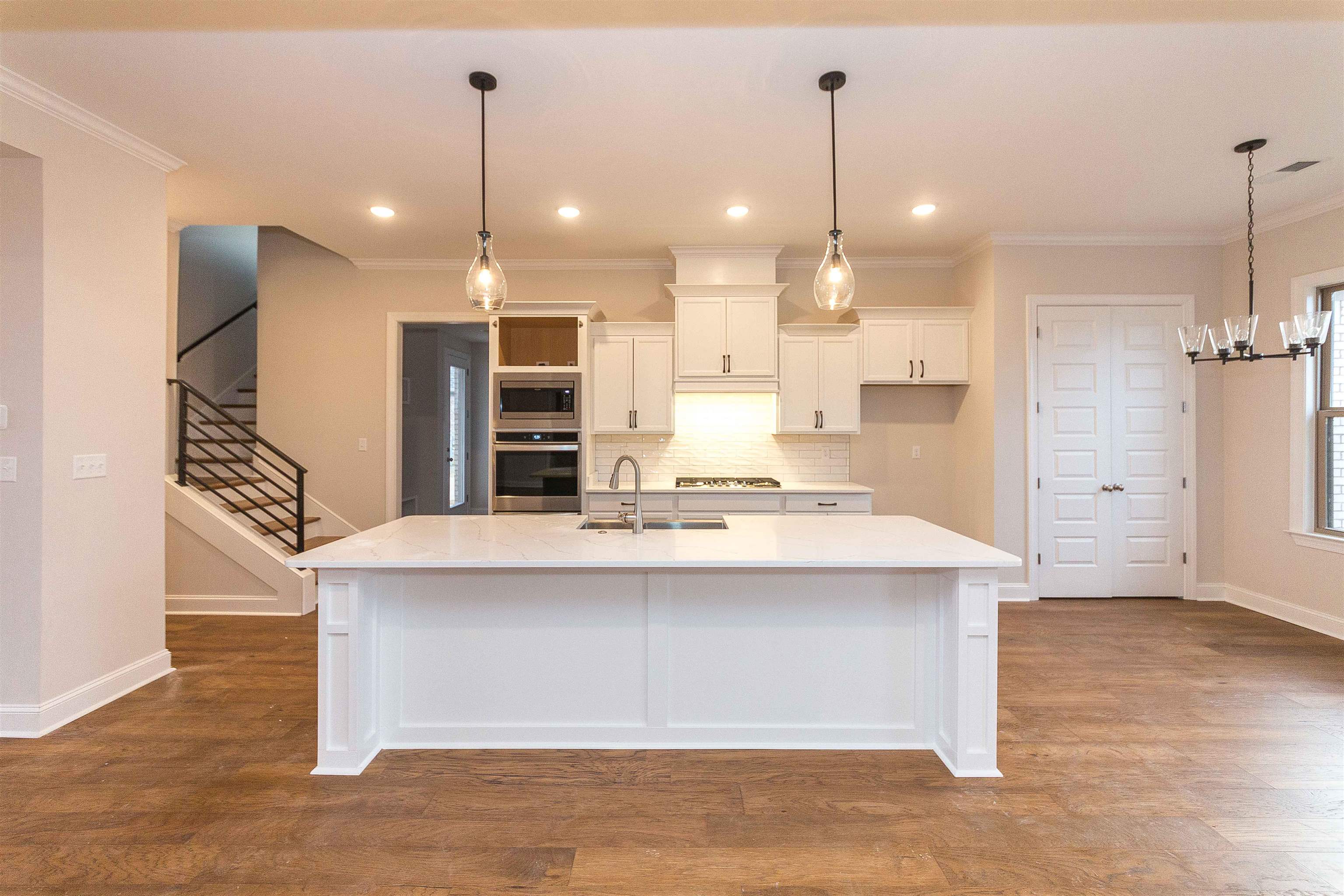 6441 Mccord Loop Arlington, TN 38002 - Photo 2 of 23 a kitchen with kitchen island a sink stainless steel appliances and cabinets