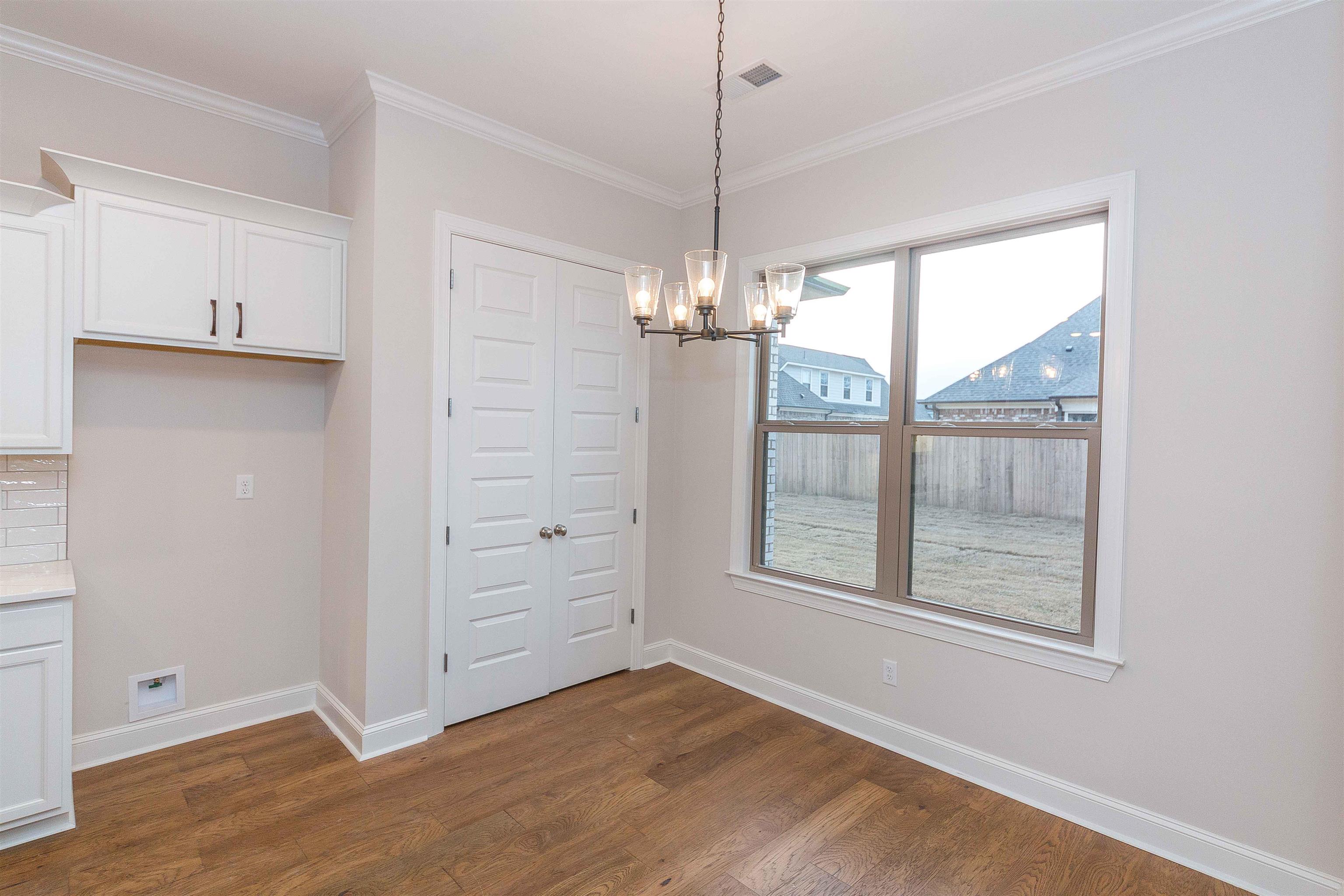 6441 Mccord Loop Arlington, TN 38002 - Photo 3 of 23 an empty room with windows and chandelier fan