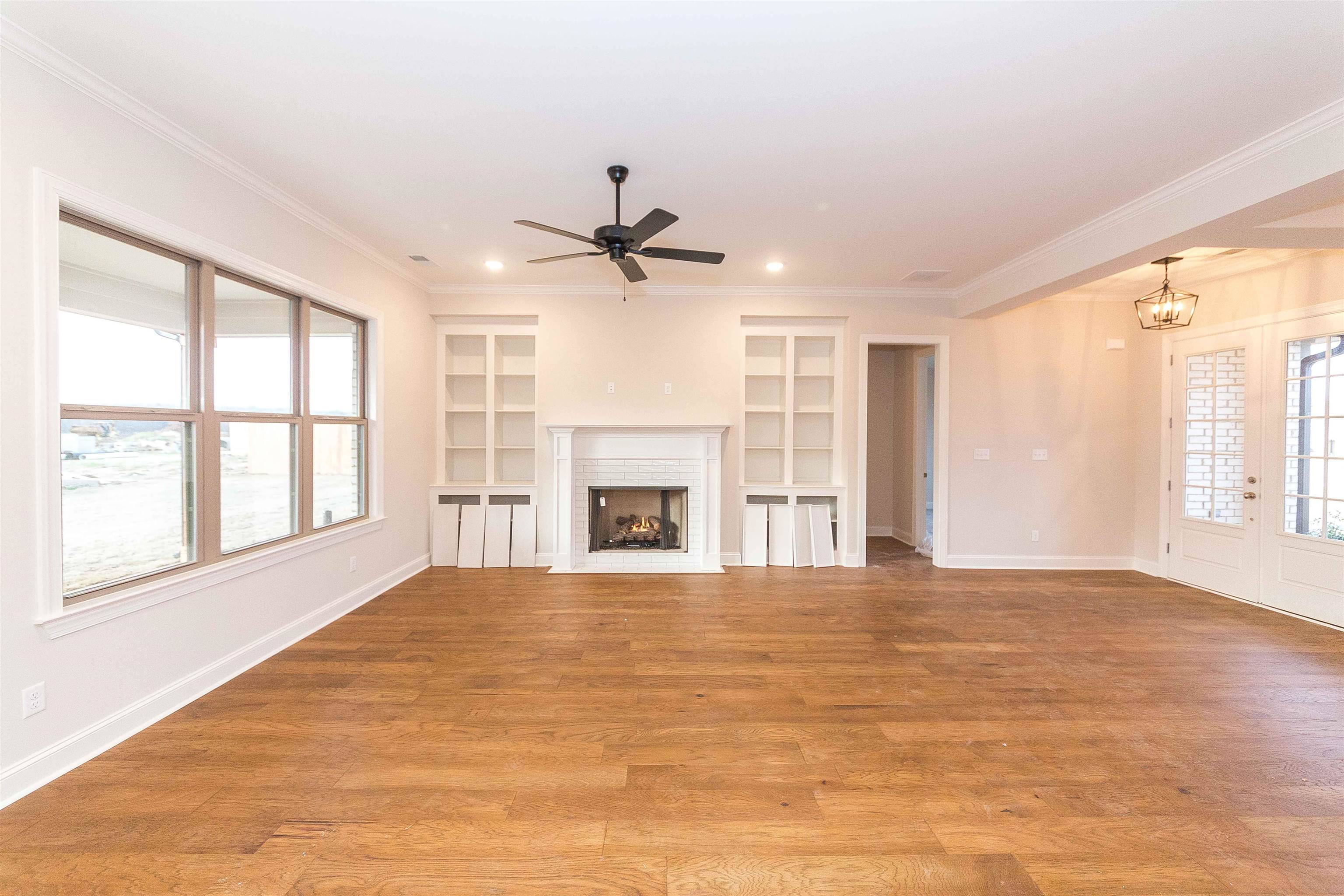 6441 Mccord Loop Arlington, TN 38002 - Photo 5 of 23 a view of an empty room with a window and a kitchen