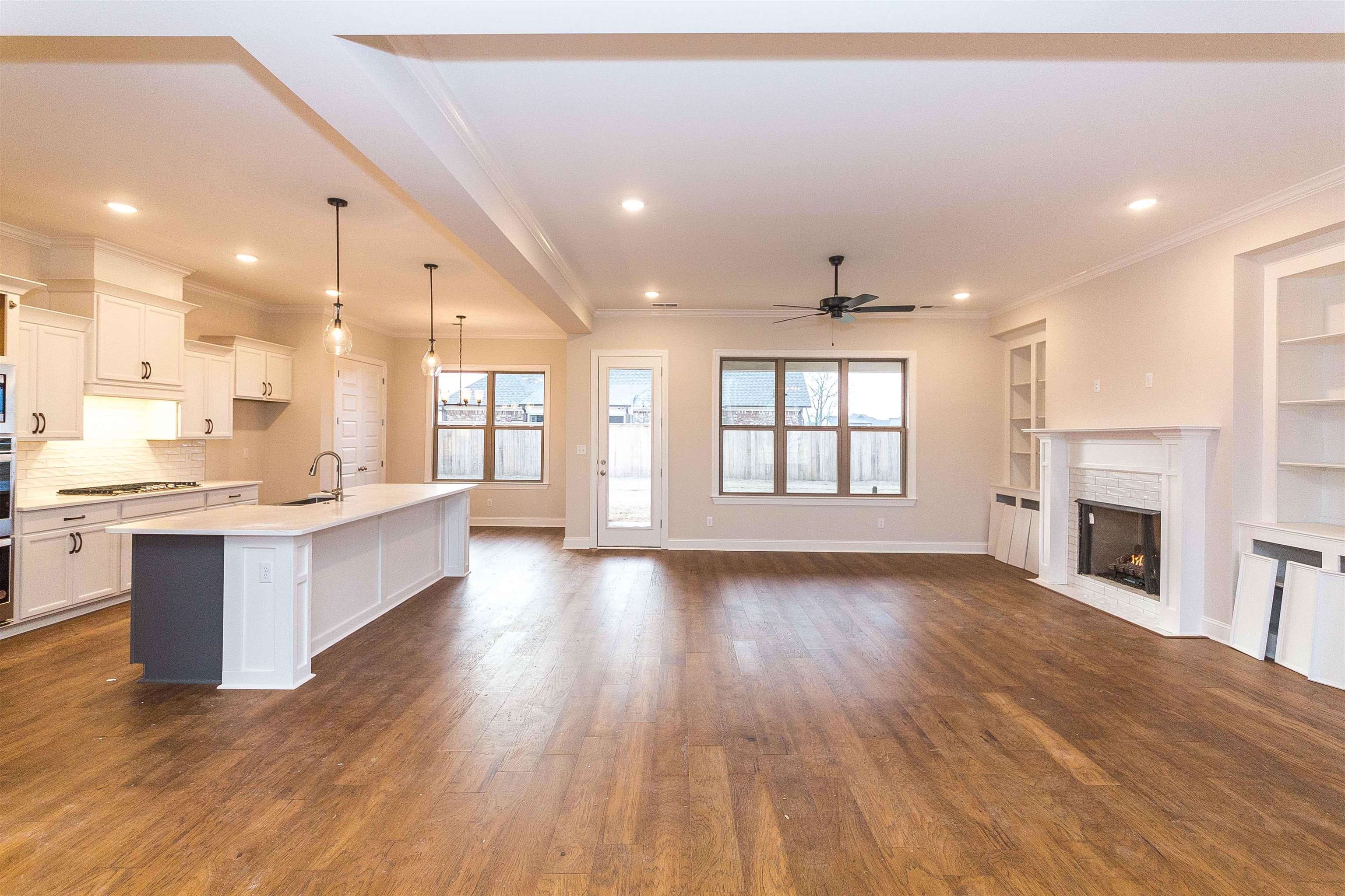 6441 Mccord Loop Arlington, TN 38002 - Photo 6 of 23 a large kitchen with granite countertop a large counter top a sink stainless steel appliances and cabinets