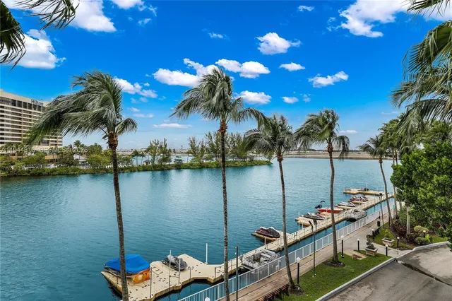a view of a patio with couches and table and chairs and potted plants