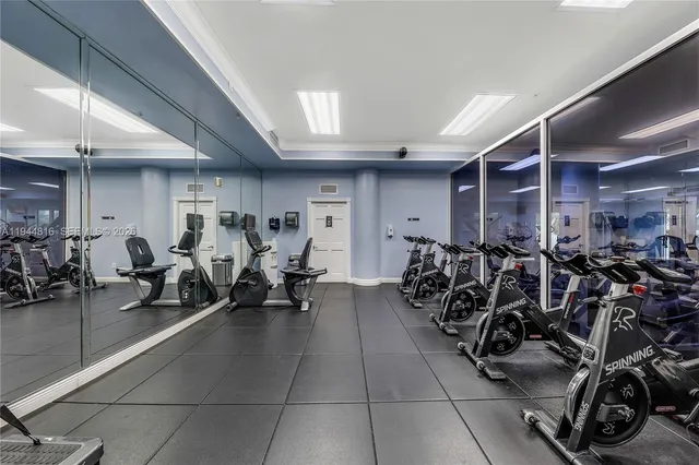 a living room with pool table and a flat screen tv
