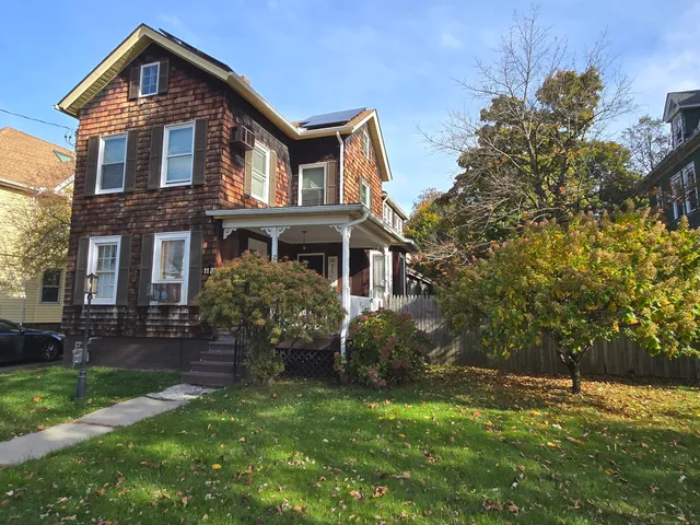 front view of a house with a yard