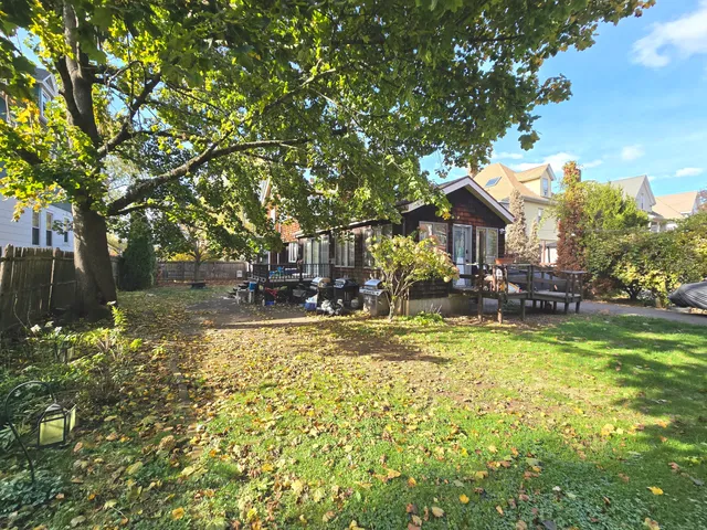a view of swimming pool and trees in the background