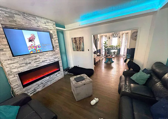 a living room with furniture and a flat screen tv
