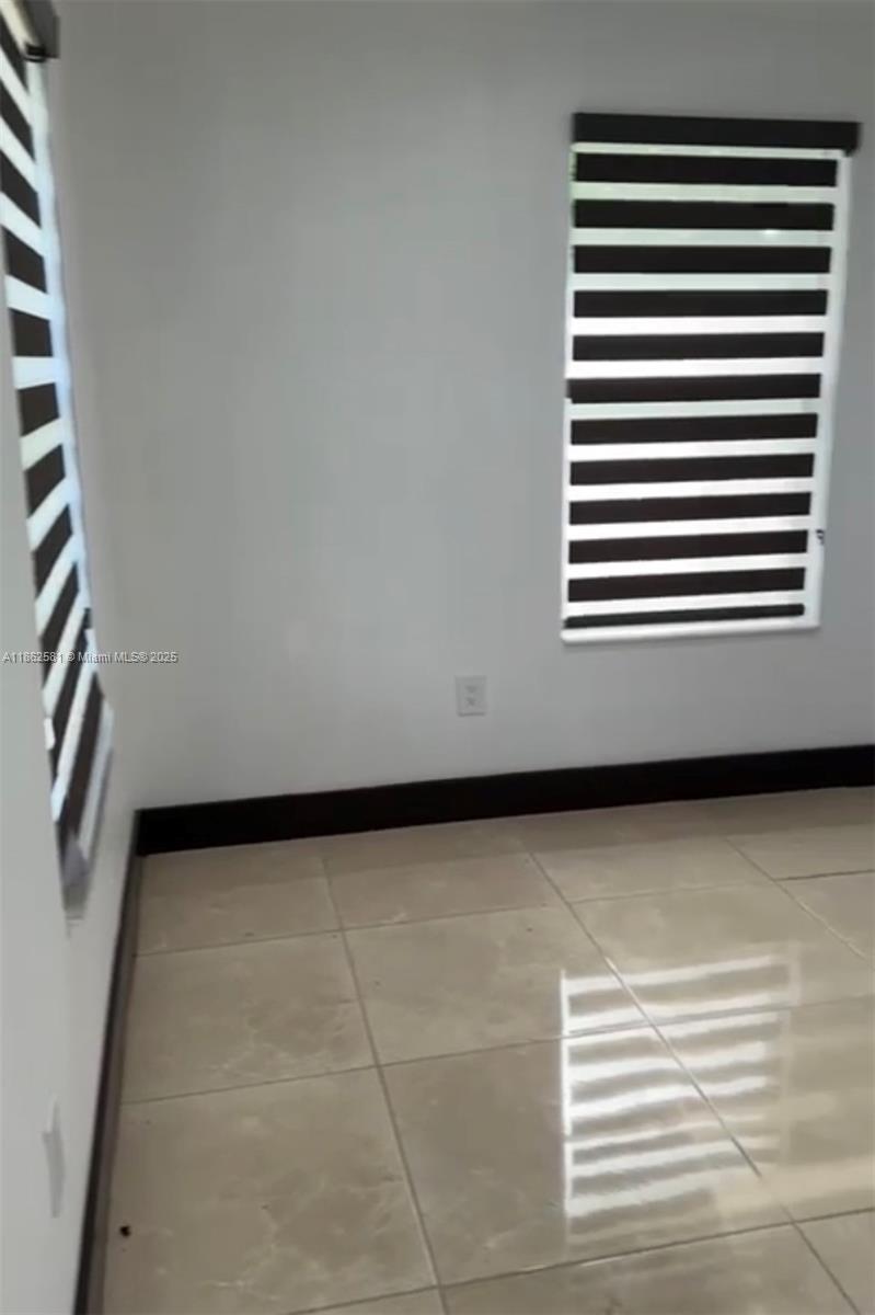 5960 Southwest 190th Avenue Southwest Ranches, FL 33332 - Photo 17 of 32 a view of a room with a black and white wall