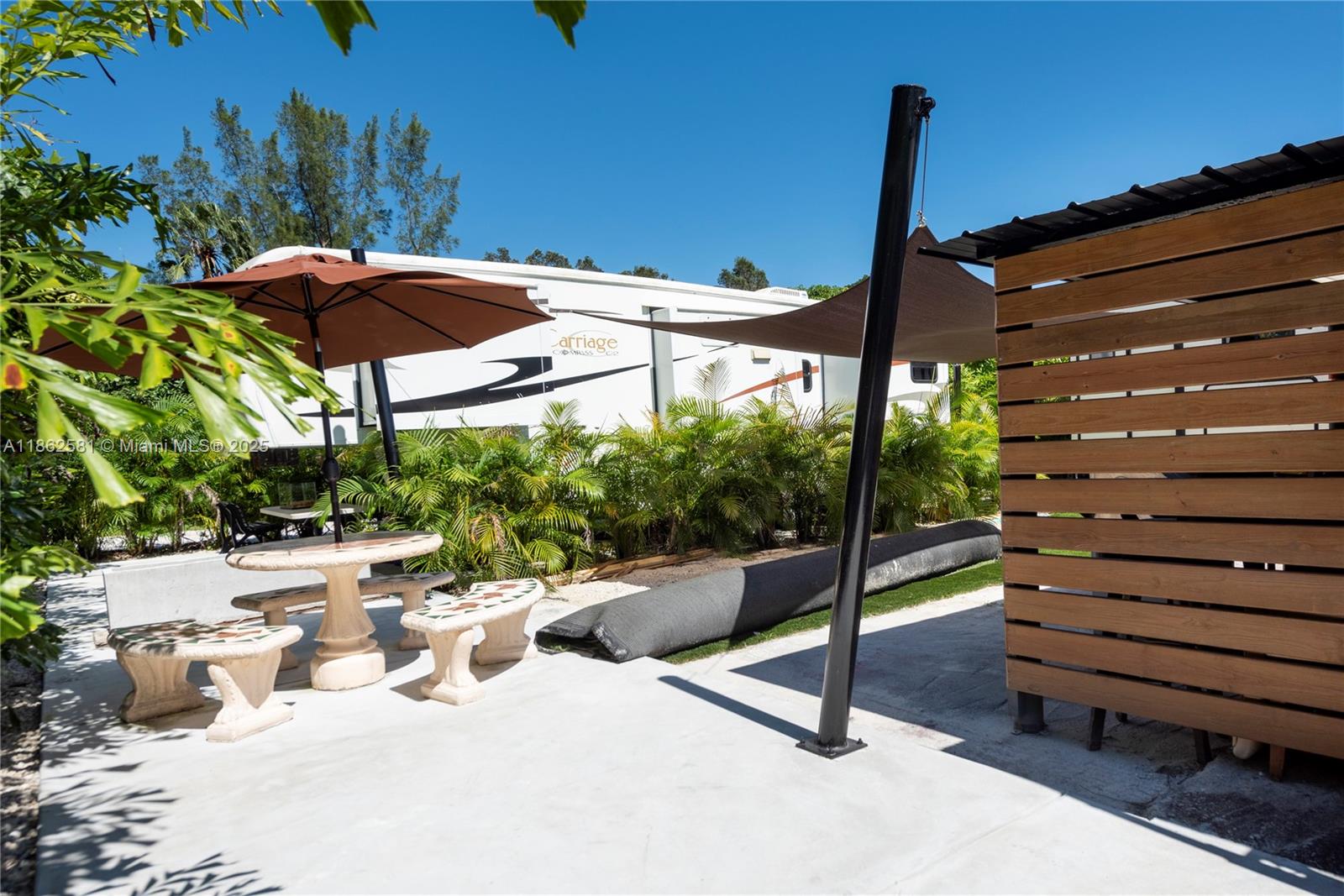 5960 Southwest 190th Avenue Southwest Ranches, FL 33332 - Photo 19 of 32 a view of a patio with a table chairs and a potted plants