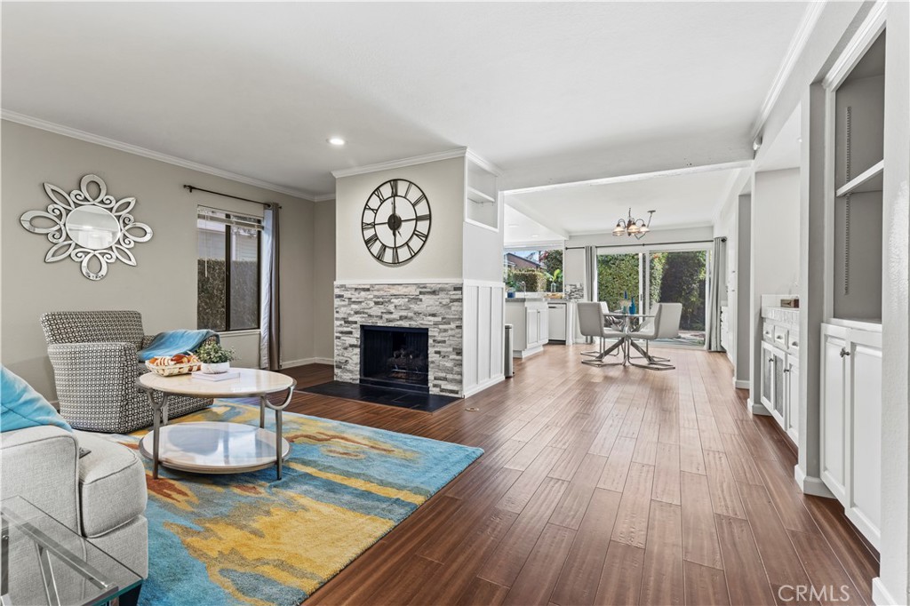 13 Recodo Irvine, CA 92620 - Photo 15 of 71 a living room with furniture a fireplace and a table