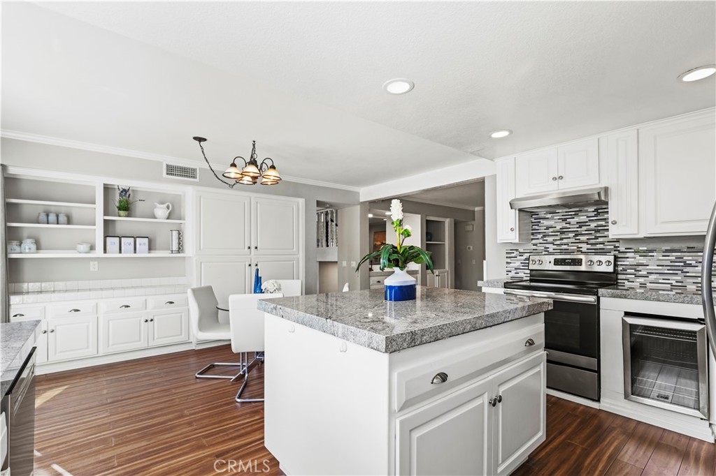 13 Recodo Irvine, CA 92620 - Photo 20 of 71 a kitchen with granite countertop a sink stove and cabinets