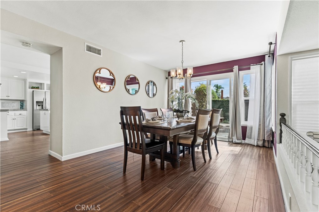 13 Recodo Irvine, CA 92620 - Photo 22 of 71 a view of a dining room with furniture window and wooden floor