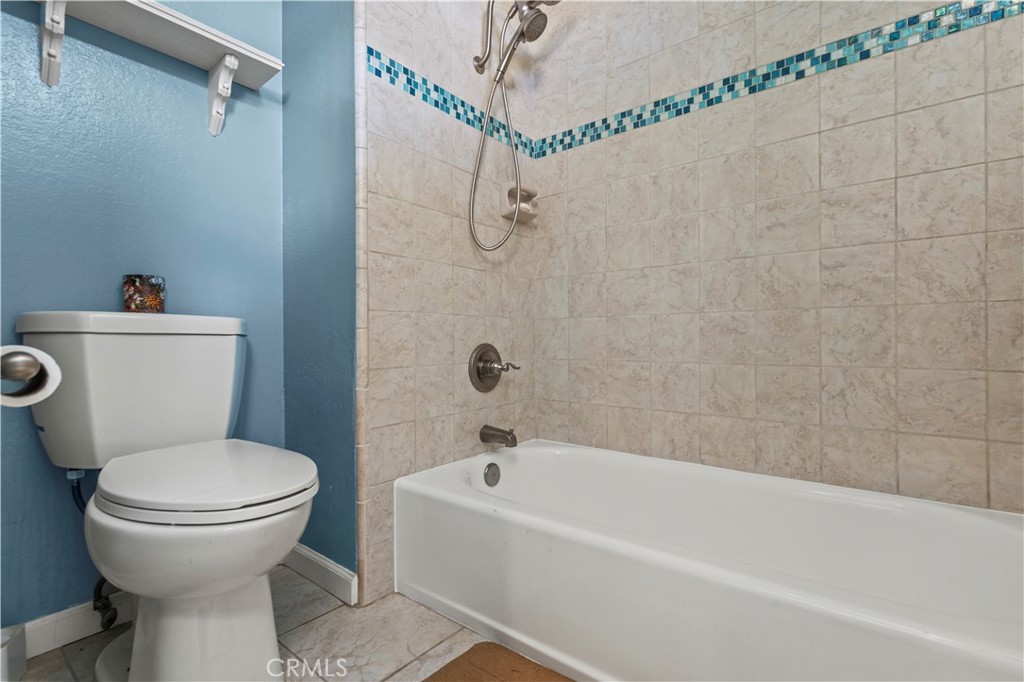 13 Recodo Irvine, CA 92620 - Photo 30 of 71 a bathroom with a toilet and a bathtub