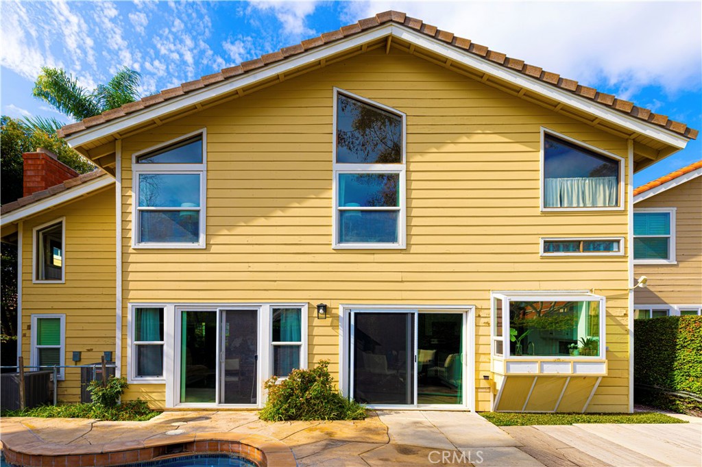 13 Recodo Irvine, CA 92620 - Photo 49 of 71 a front view of a house with a yard