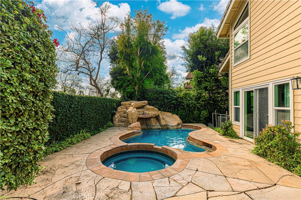 13 Recodo Irvine, CA 92620 - Photo 51 of 71 a table and chairs in a backyard of the house