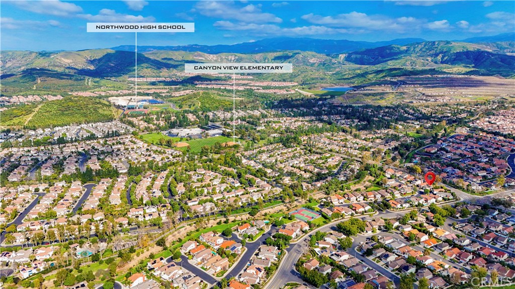 13 Recodo Irvine, CA 92620 - Photo 66 of 71 a view of a lake with a building in the background