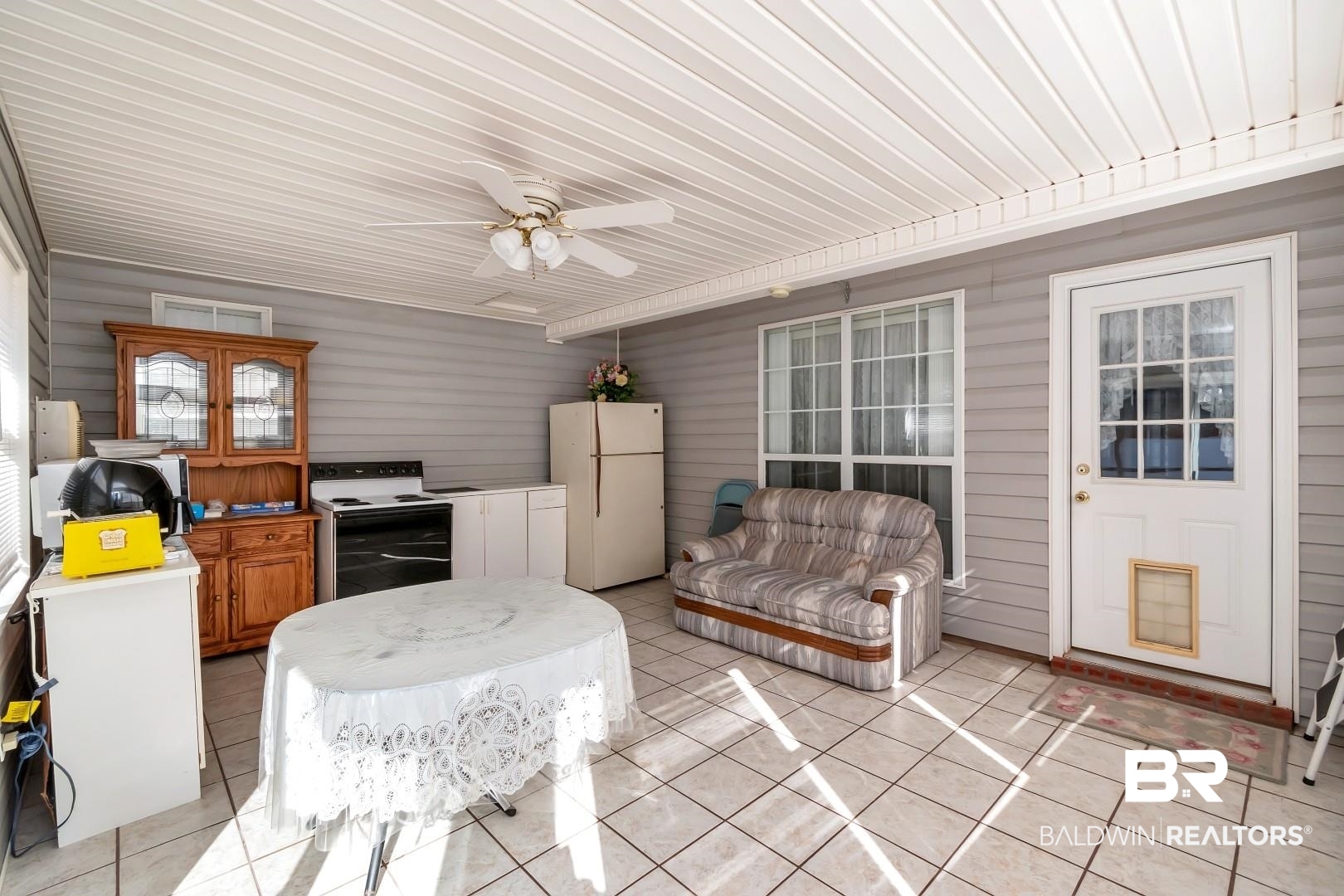 8221 Woodbend Drive Semmes, AL 36575 - Photo 28 of 35 Interior space with ceiling fan and an outdoor kitchen