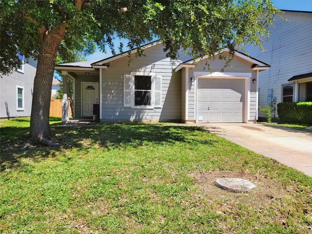 77 Jan Lane Georgetown, TX 78626 - Photo 1 of 1 a view of a house with a yard