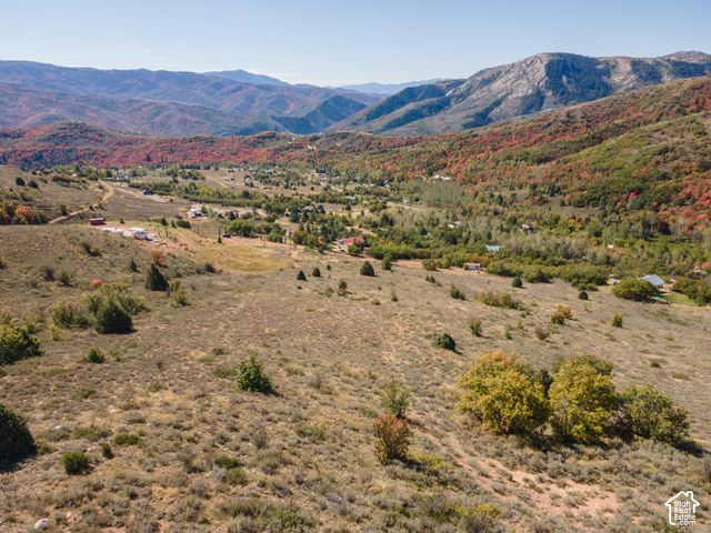 3378 Spring Way, Unit 410 Huntsville, UT 84317 - Photo 6 of 24 Expansive mountainous landscape with natural terrain, distant structures, and diverse tree coverage