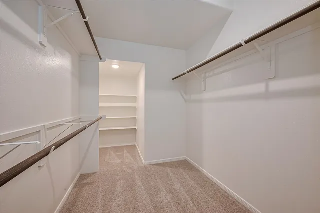 a view of an empty walk in closet