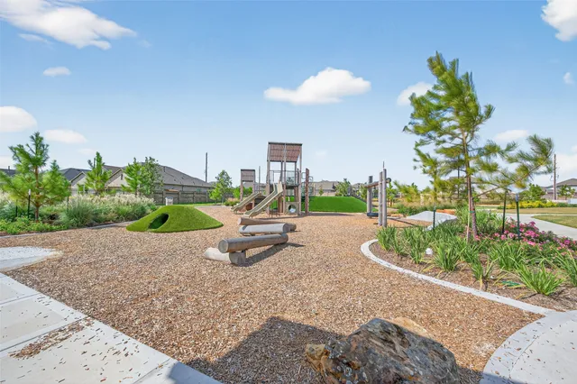 a view of a house with a backyard and porch