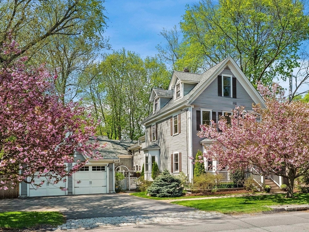 20 Maple Street Lexington, MA 02420 - Photo 1 of 36 a front view of a house with a yard and large trees
