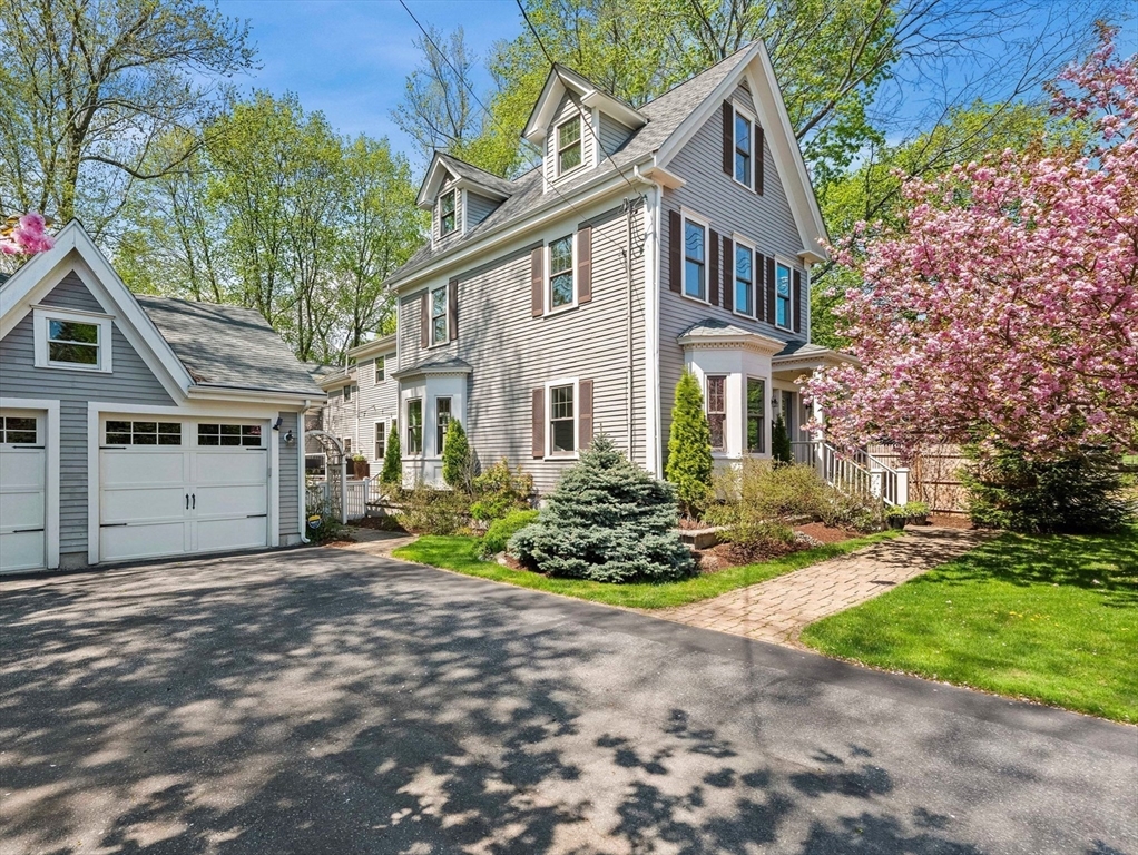 20 Maple Street Lexington, MA 02420 - Photo 2 of 36 a front view of a house with a yard and outdoor seating