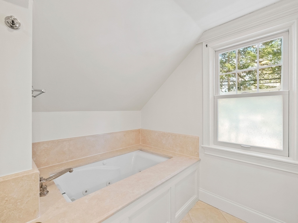 20 Maple Street Lexington, MA 02420 - Photo 21 of 36 a bathroom with a bathtub and window