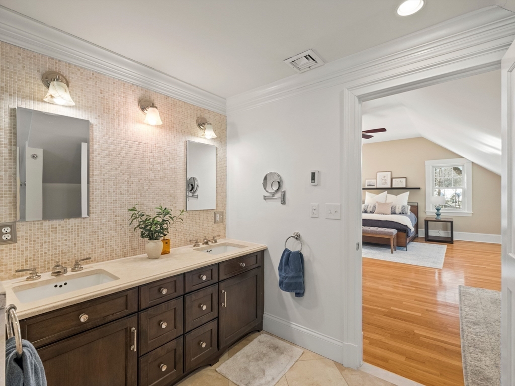 20 Maple Street Lexington, MA 02420 - Photo 22 of 36 a spacious bathroom with a double vanity sink and a mirror