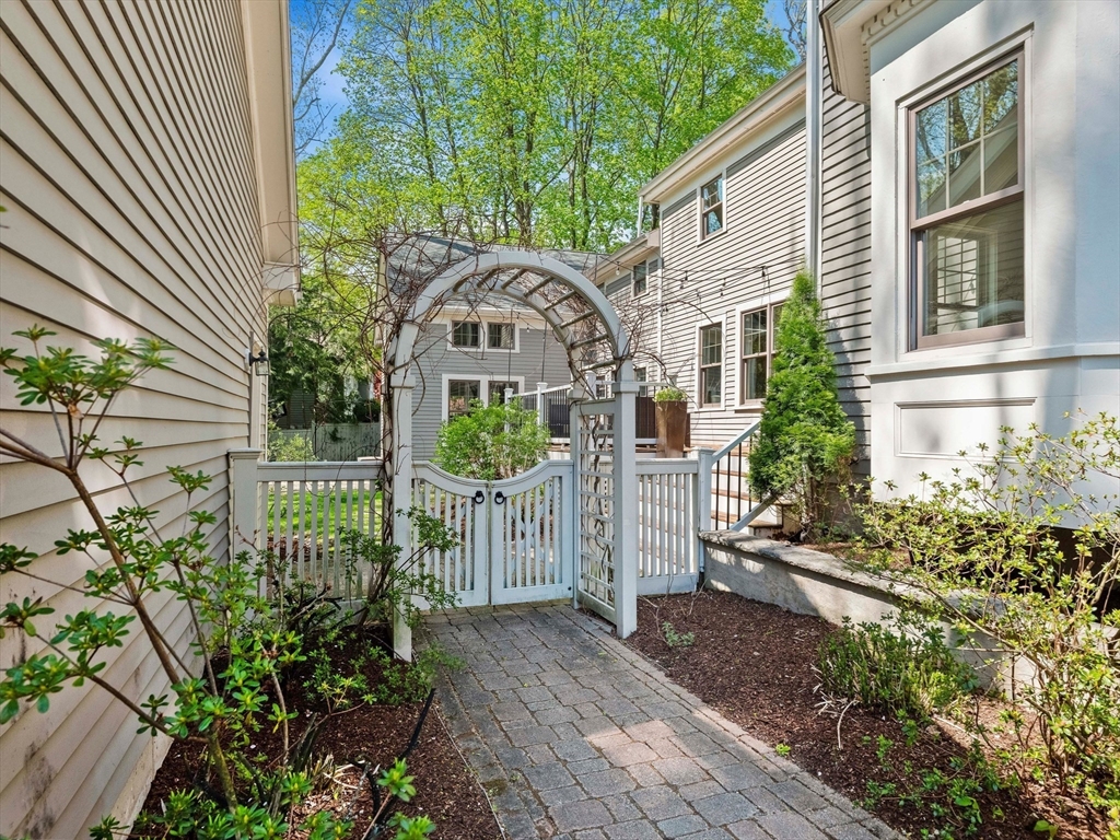 20 Maple Street Lexington, MA 02420 - Photo 32 of 36 a front view of a house with garden