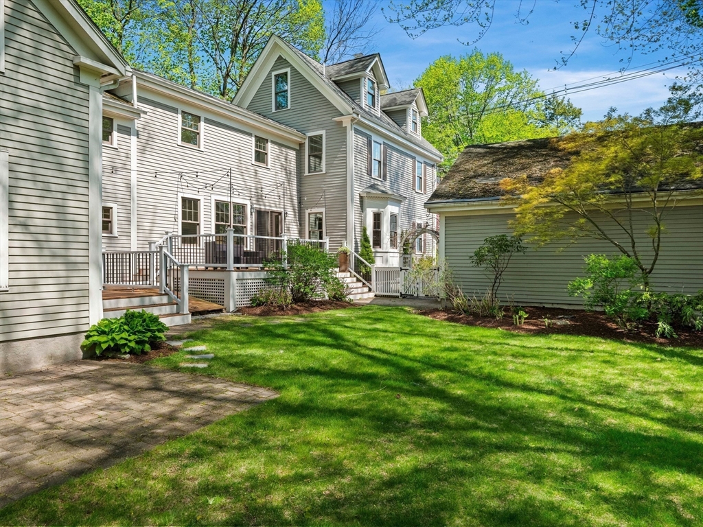 20 Maple Street Lexington, MA 02420 - Photo 34 of 36 a front view of a house with garden