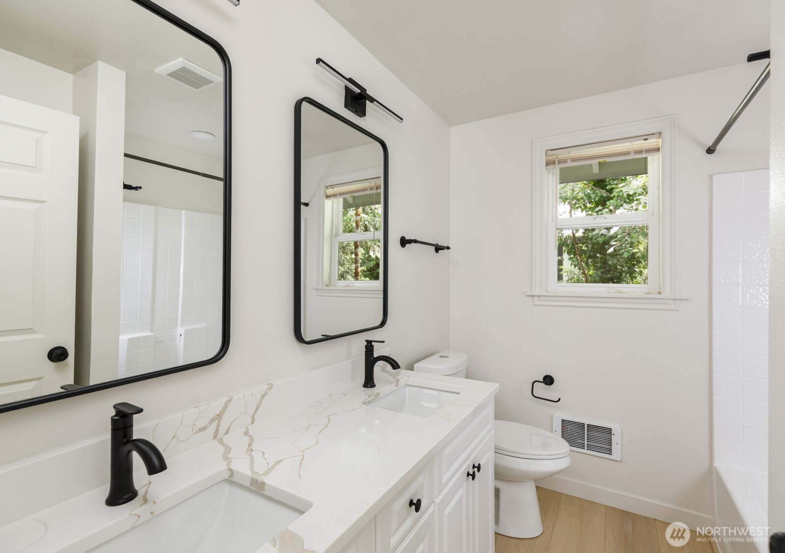 7605 Northeast Hidden Cove Road Bainbridge Island, WA 98110 - Photo 34 of 36 a bathroom with a toilet sink and mirror