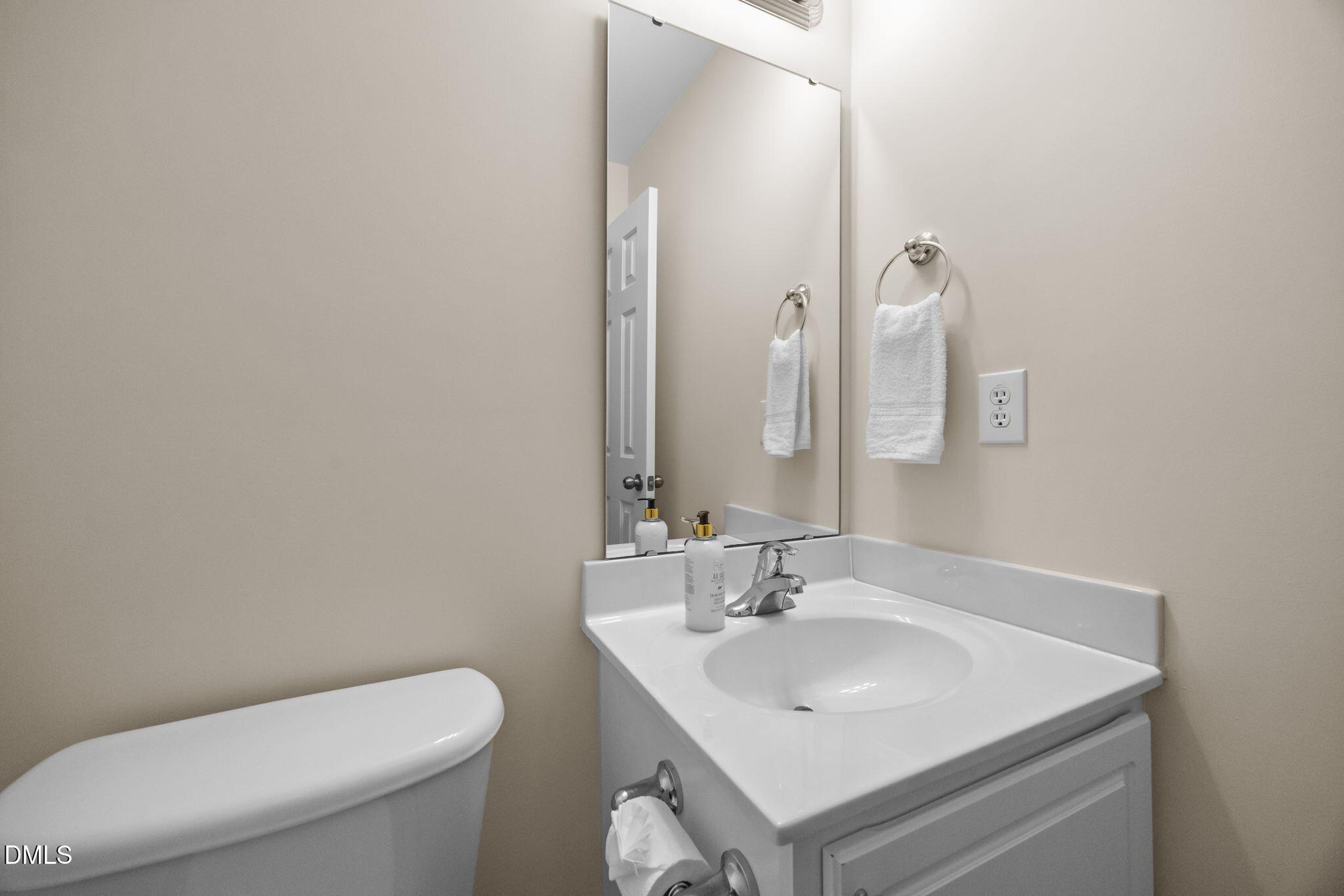505 Vinson Road Clayton, NC 27527 - Photo 16 of 31 a bathroom with a toilet sink and mirror
