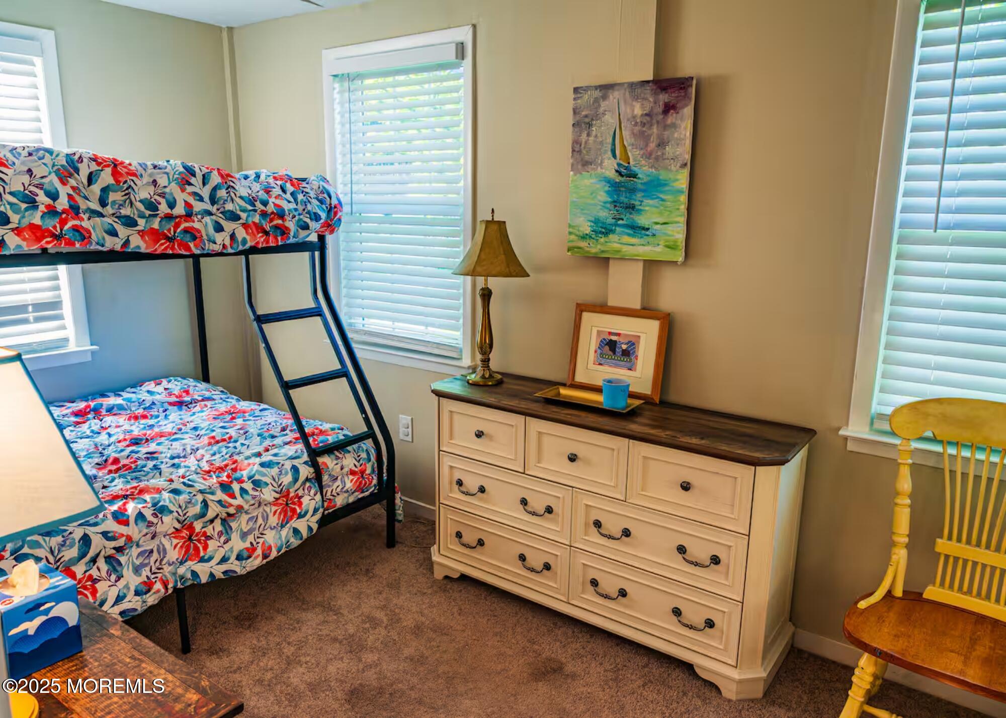 70S Bath Avenue, Unit 1 Long Branch, NJ 07740 - Photo 12 of 19 a bedroom with a bed and wooden floor