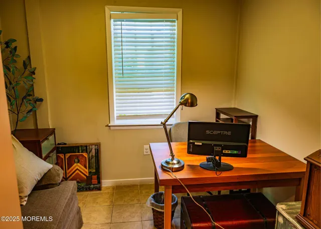 a view of a livingroom with furniture and hardwood floor