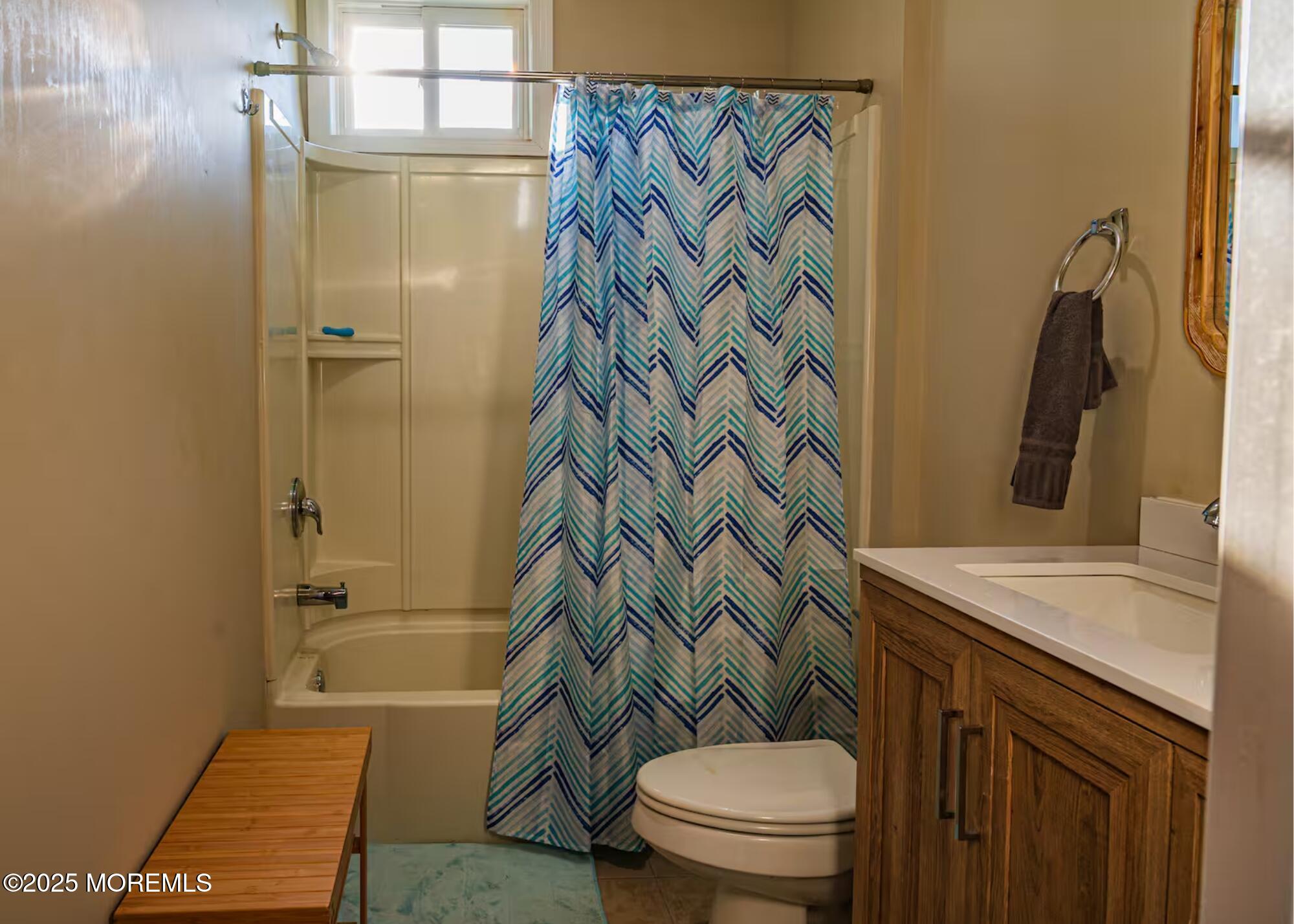 70S Bath Avenue, Unit 1 Long Branch, NJ 07740 - Photo 15 of 19 a bathroom with a granite countertop sink toilet and shower