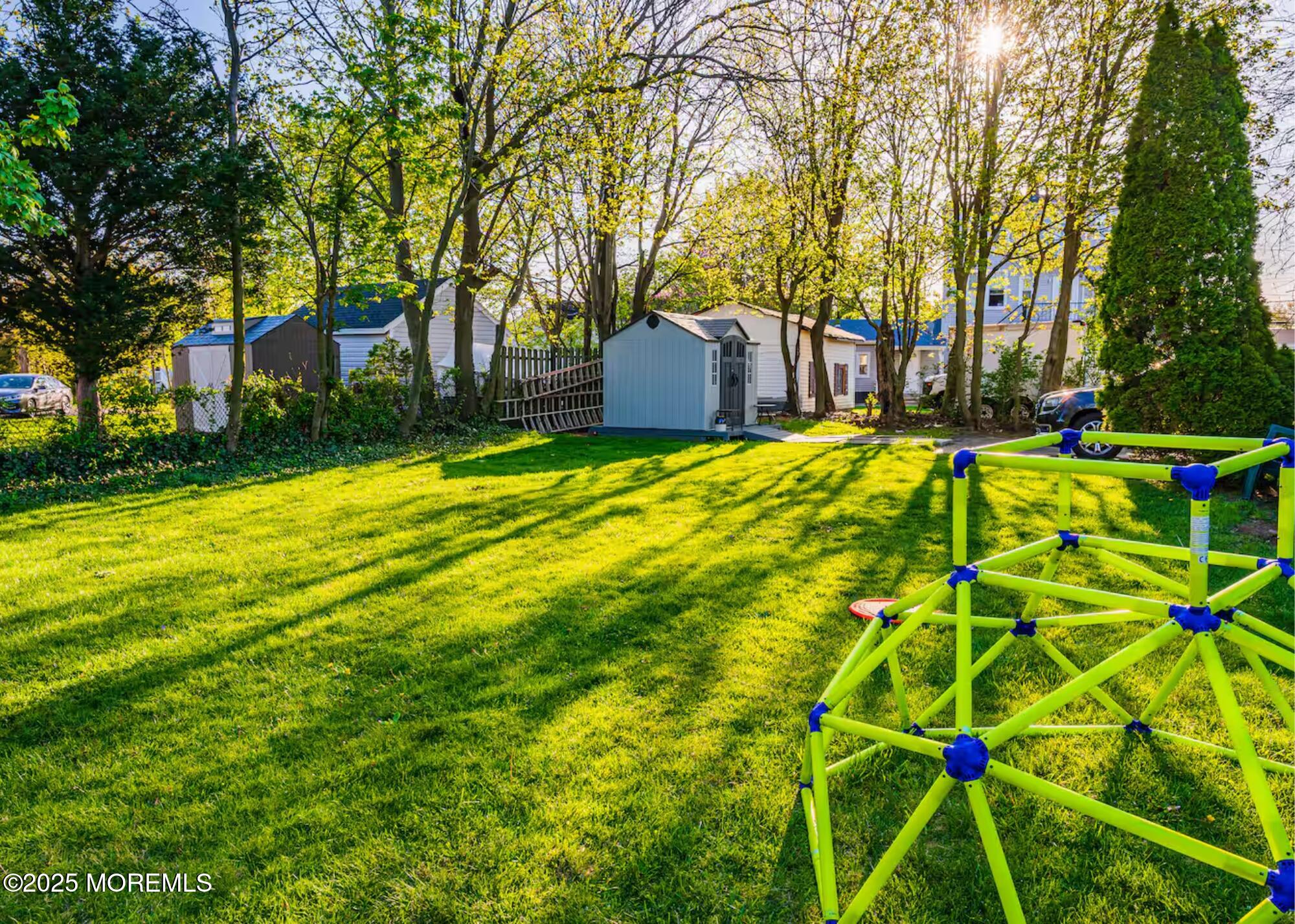 70S Bath Avenue, Unit 1 Long Branch, NJ 07740 - Photo 4 of 19 a backyard of a house with a yard and tree