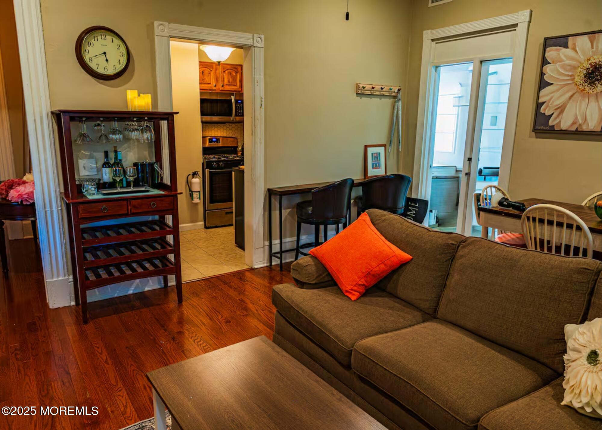 70S Bath Avenue, Unit 1 Long Branch, NJ 07740 - Photo 7 of 19 a living room with furniture rug and wooden floor