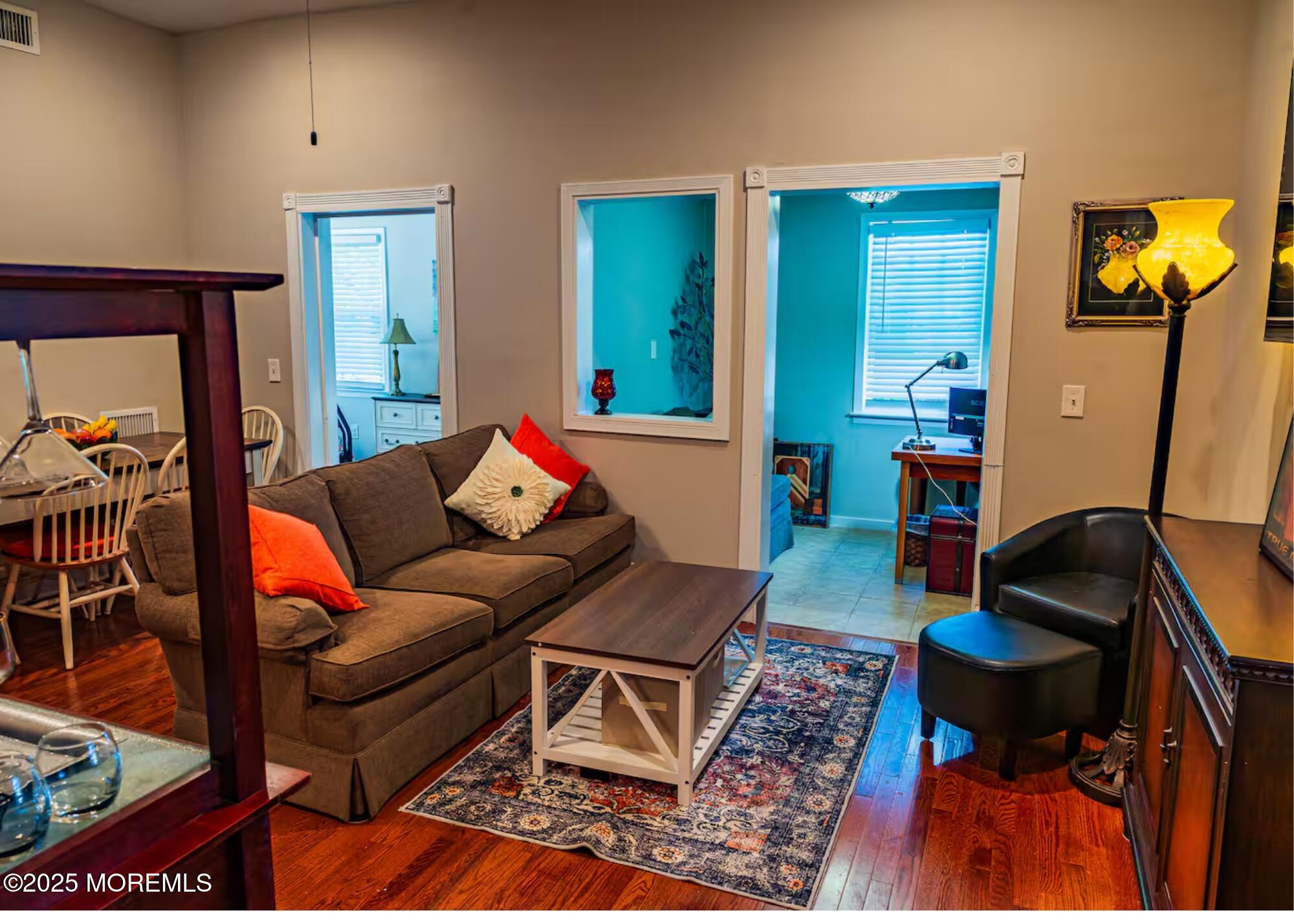 70S Bath Avenue, Unit 1 Long Branch, NJ 07740 - Photo 8 of 19 a living room with furniture and a rug