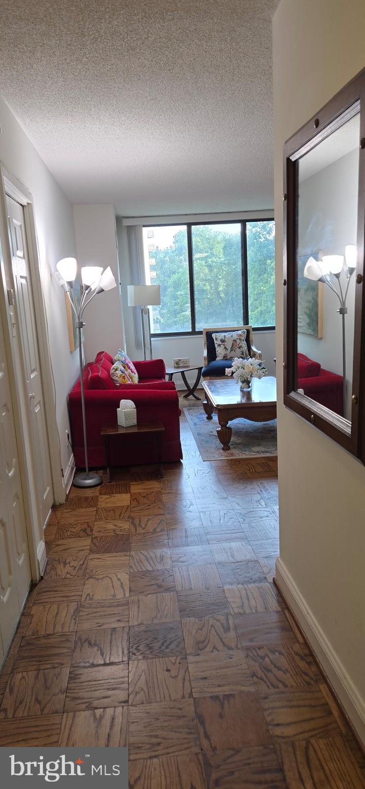 5225 Pooks Hill Road, Unit 703N Bethesda, MD 20814 - Photo 13 of 57 a living room with furniture and a large window