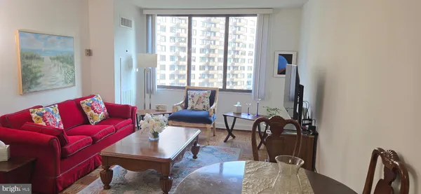 a living room with furniture and a window