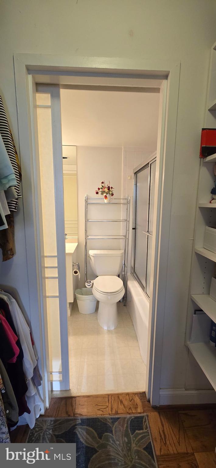 5225 Pooks Hill Road, Unit 703N Bethesda, MD 20814 - Photo 19 of 57 a bathroom with a sink a toilet and shower