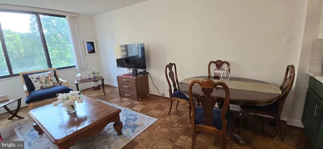 a view of a dining room with furniture window and outside view