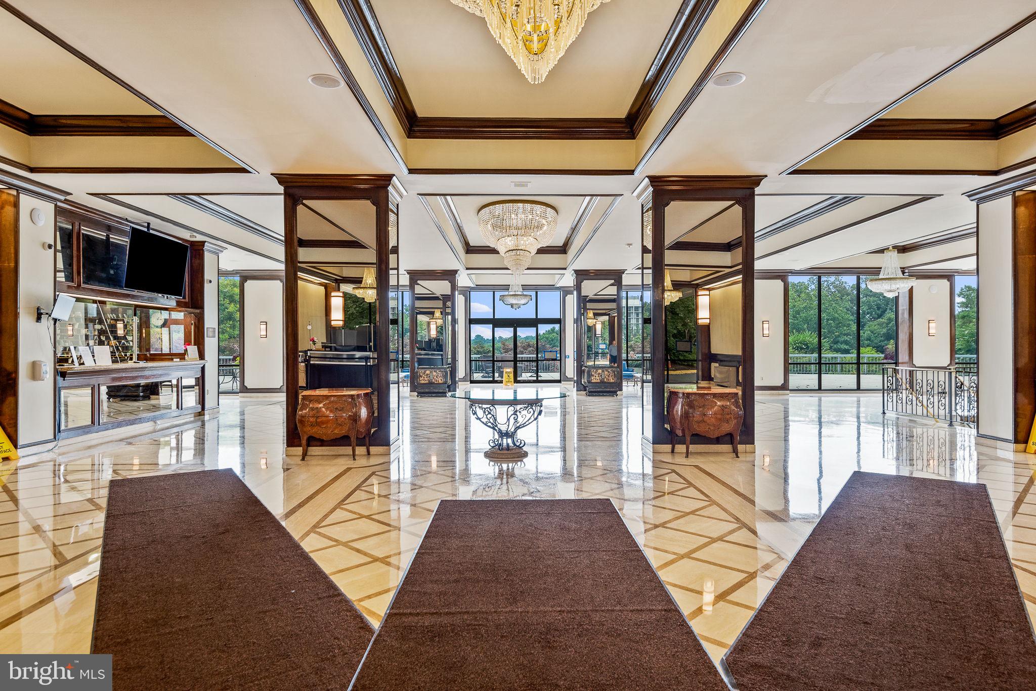 5225 Pooks Hill Road, Unit 703N Bethesda, MD 20814 - Photo 21 of 57 a lobby with furniture and large windows