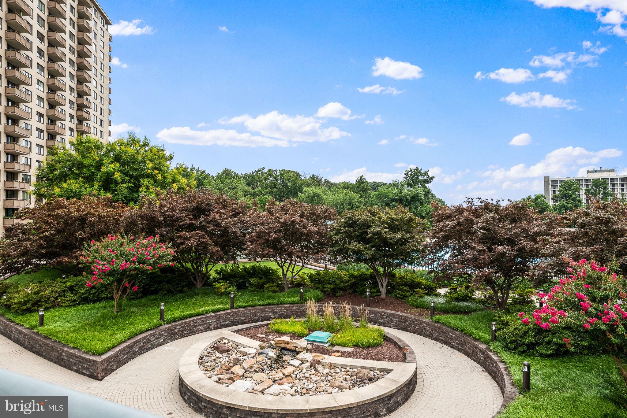 5225 Pooks Hill Road, Unit 703N Bethesda, MD 20814 - Photo 24 of 57 a view of a swimming pool with a yard