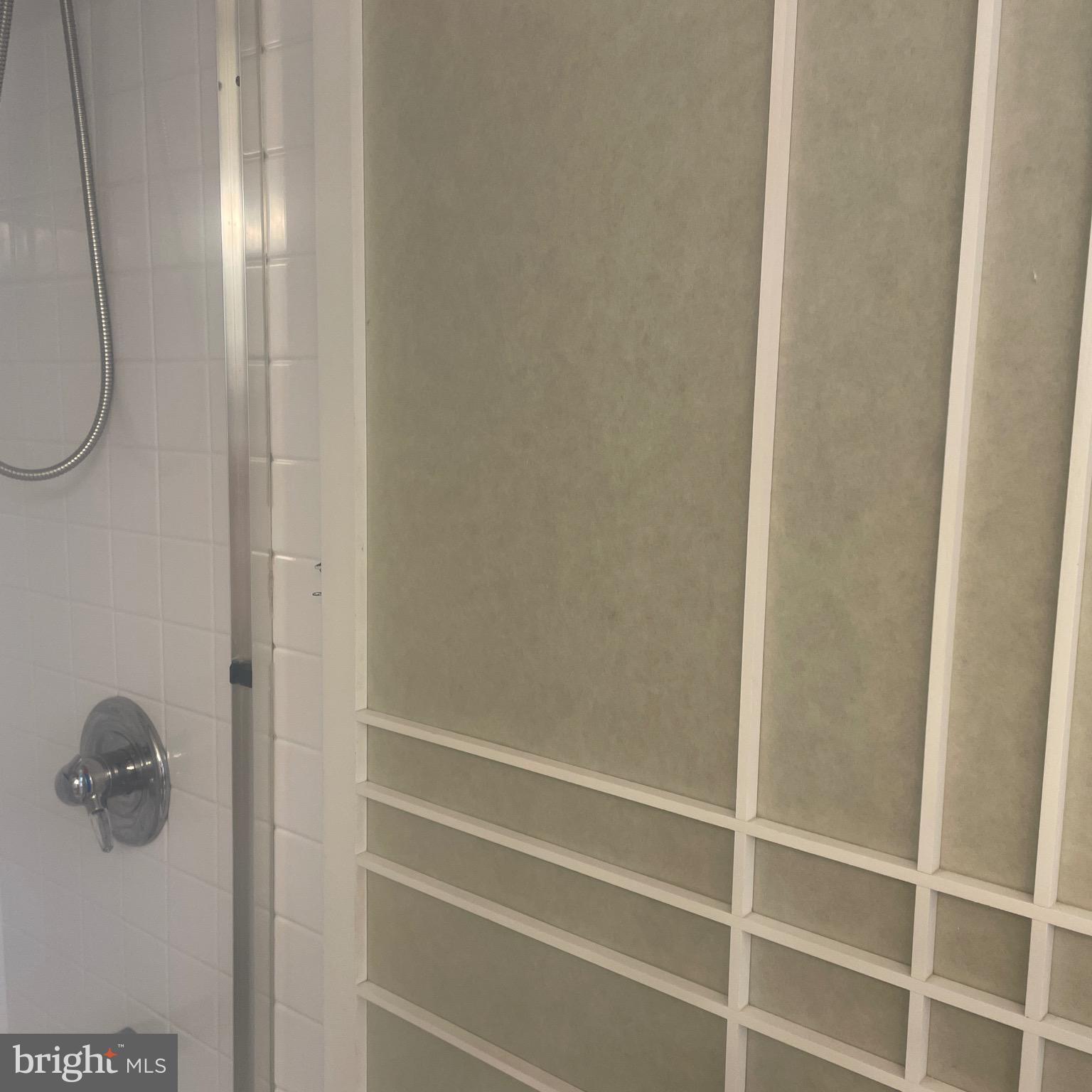 5225 Pooks Hill Road, Unit 703N Bethesda, MD 20814 - Photo 7 of 55 a bathroom with a glass shower door