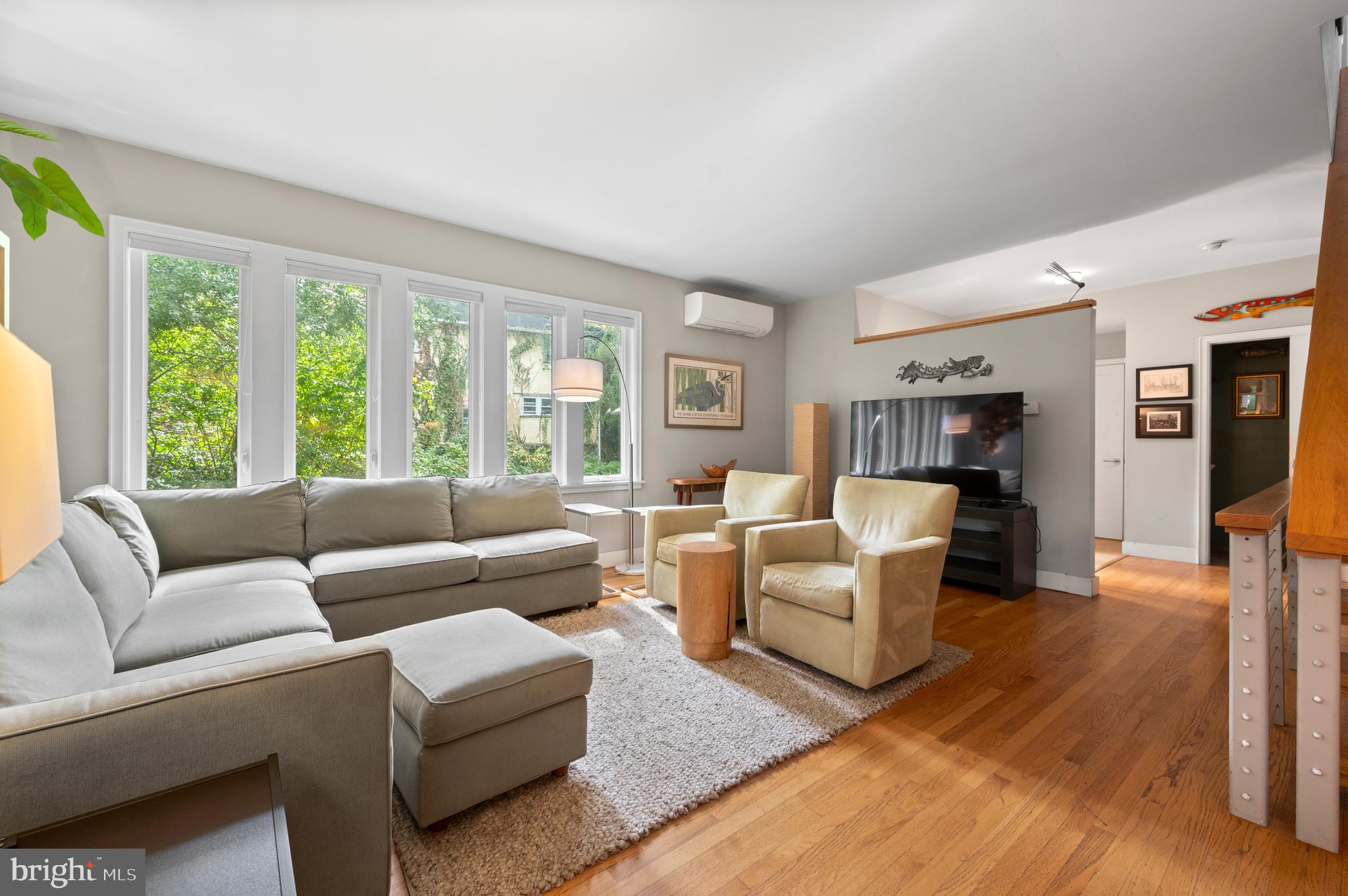 414 Mcclenaghan Mill Road Wynnewood, PA 19096 - Photo 13 of 43 a living room with furniture and a large window