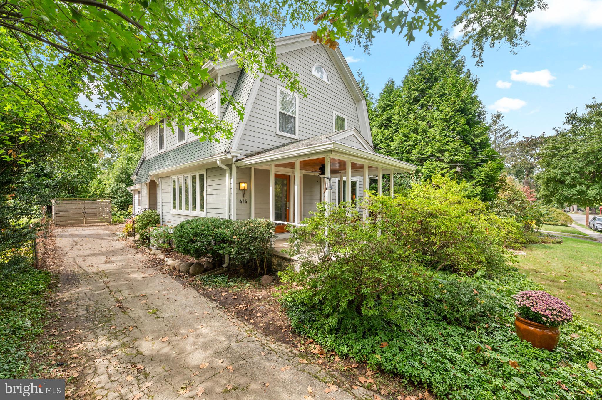 414 Mcclenaghan Mill Road Wynnewood, PA 19096 - Photo 3 of 43 a front view of a house with a yard and potted plants