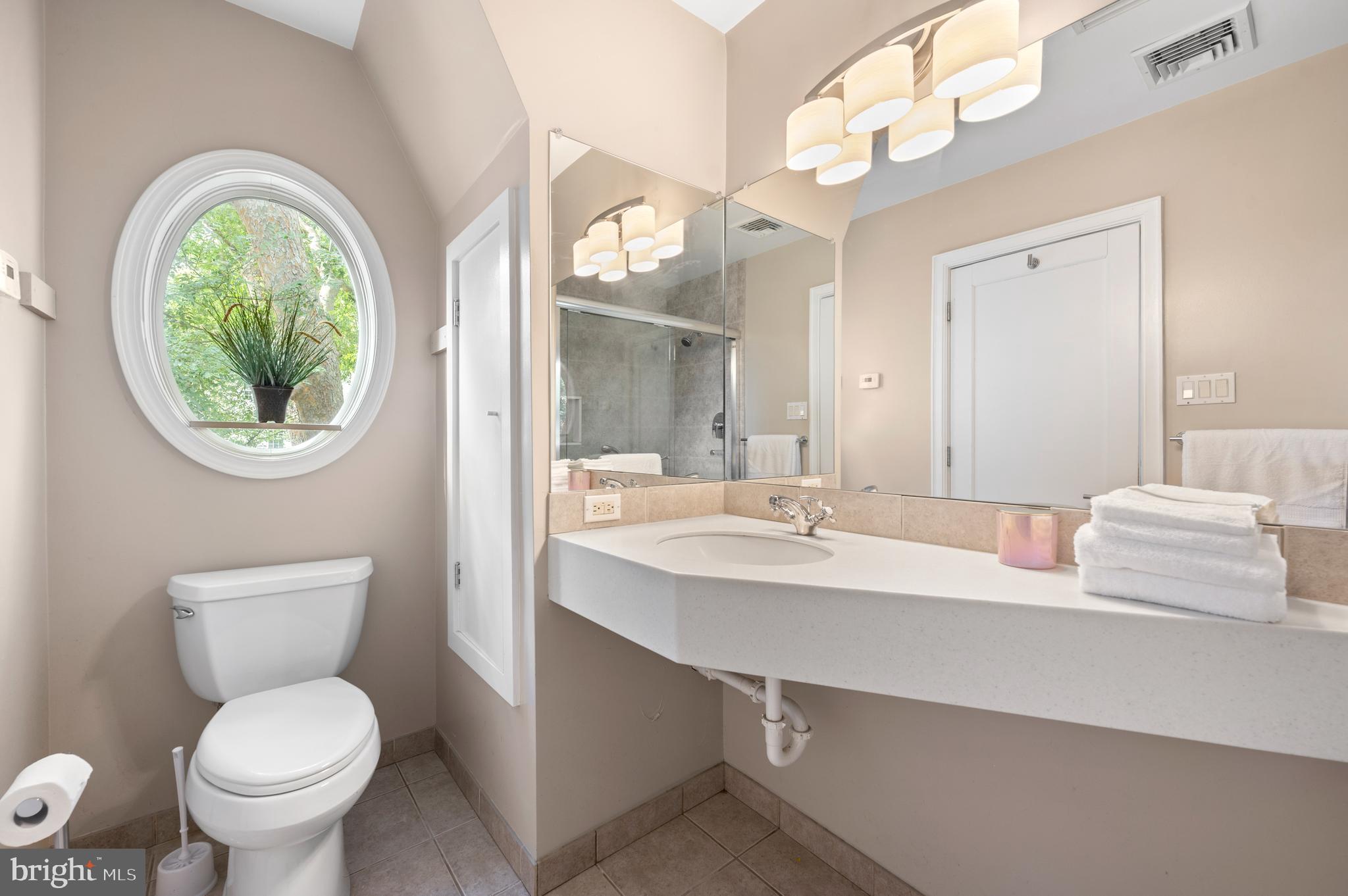 414 Mcclenaghan Mill Road Wynnewood, PA 19096 - Photo 42 of 43 a bathroom with a toilet a sink and a mirror
