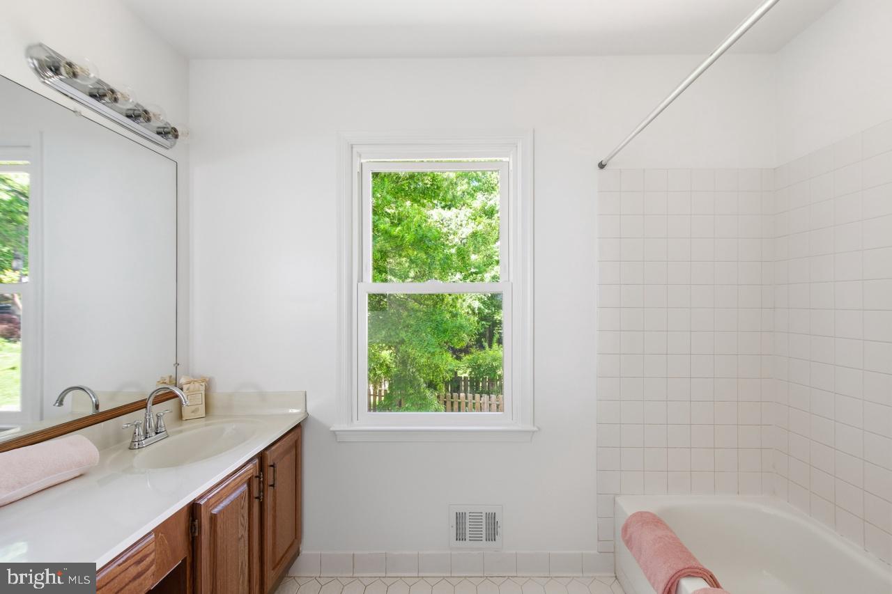 7100 Counter Place Burke, VA 22015 - Photo 36 of 54 Hall bath, dbl vanities,
tub shower&